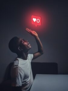There is a man looking up and there is a social media notification heart with the 0 number floating to express the end.